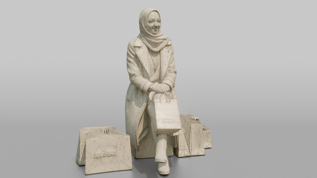 Hijab Woman in Camel Coat Sitting with Shopping Bags