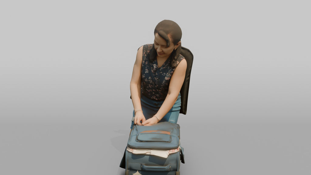 Traveler Kneeling To Zip Her Suitcase