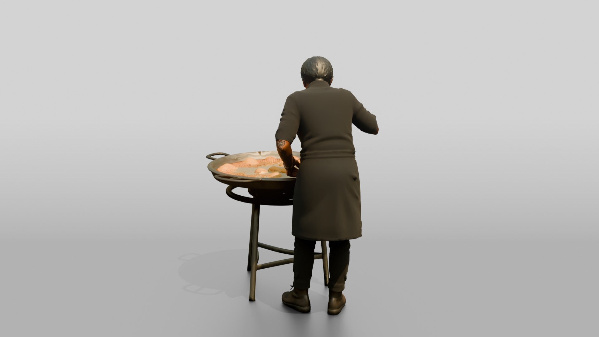 Chef Checking a Paella Pan