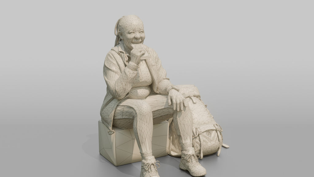Hiker Sitting and Eating an Energy Bar
