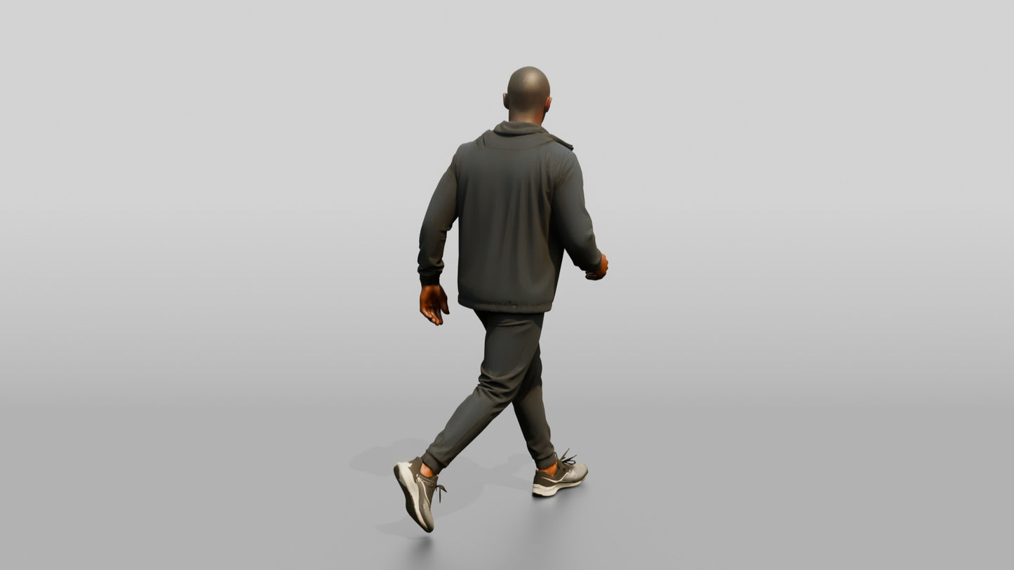 Black Man in Navy Windbreaker Walking Quickly