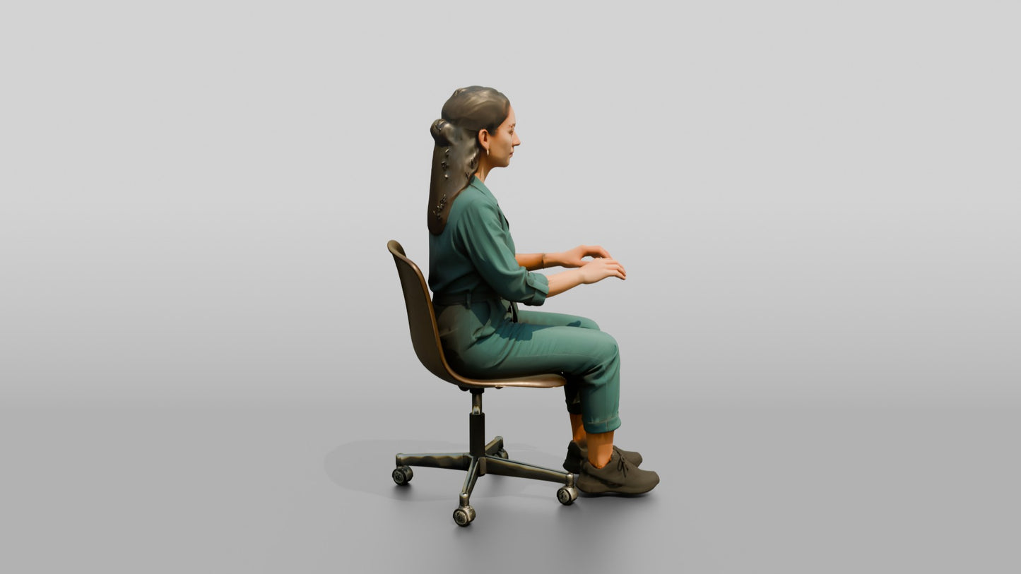 Woman Seated in a Teal Jumpsuit