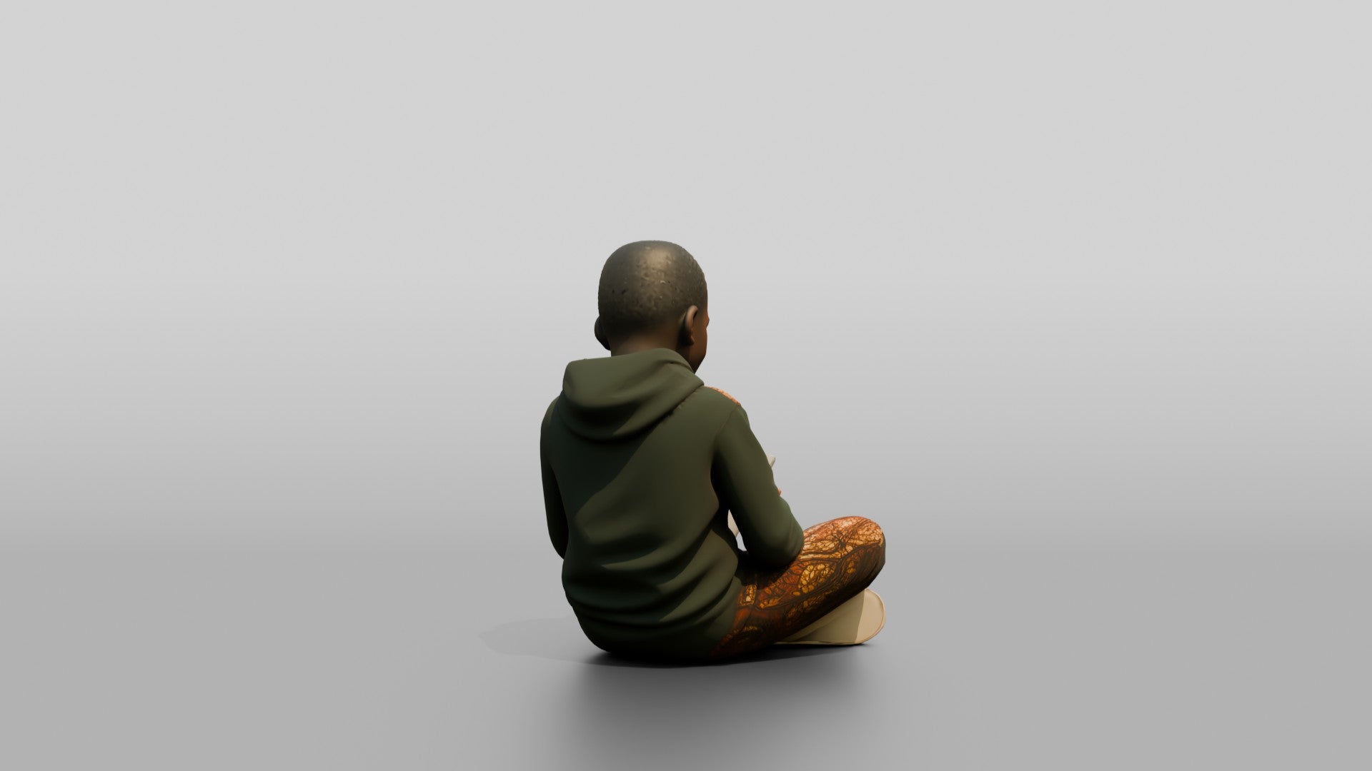 African Boy Sitting Cross-Legged with a Tablet