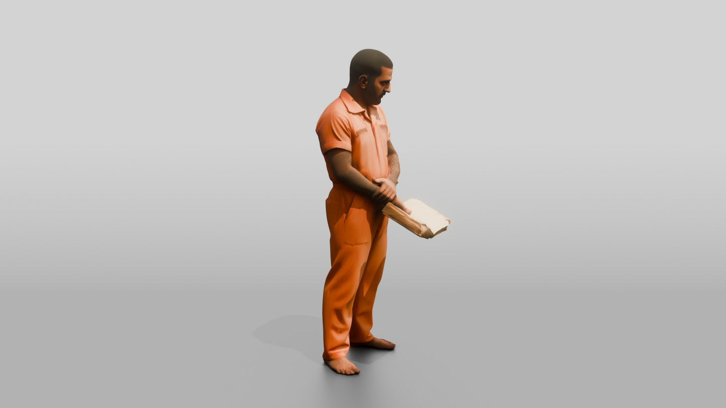 South Asian Male Prisoner Holding a Worn Book Open in One Hand