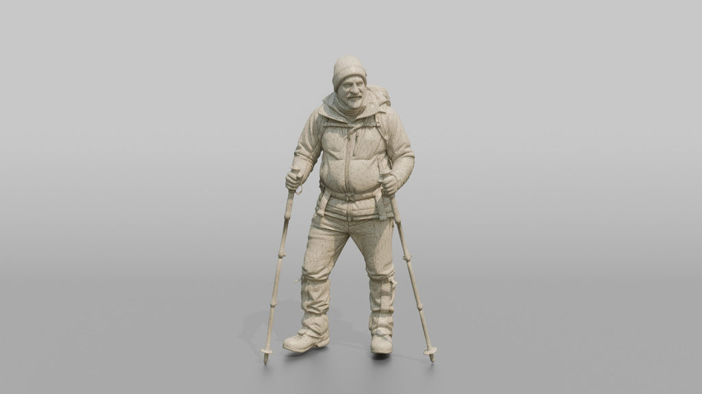 Hiker Planting Trekking Poles in the Snow