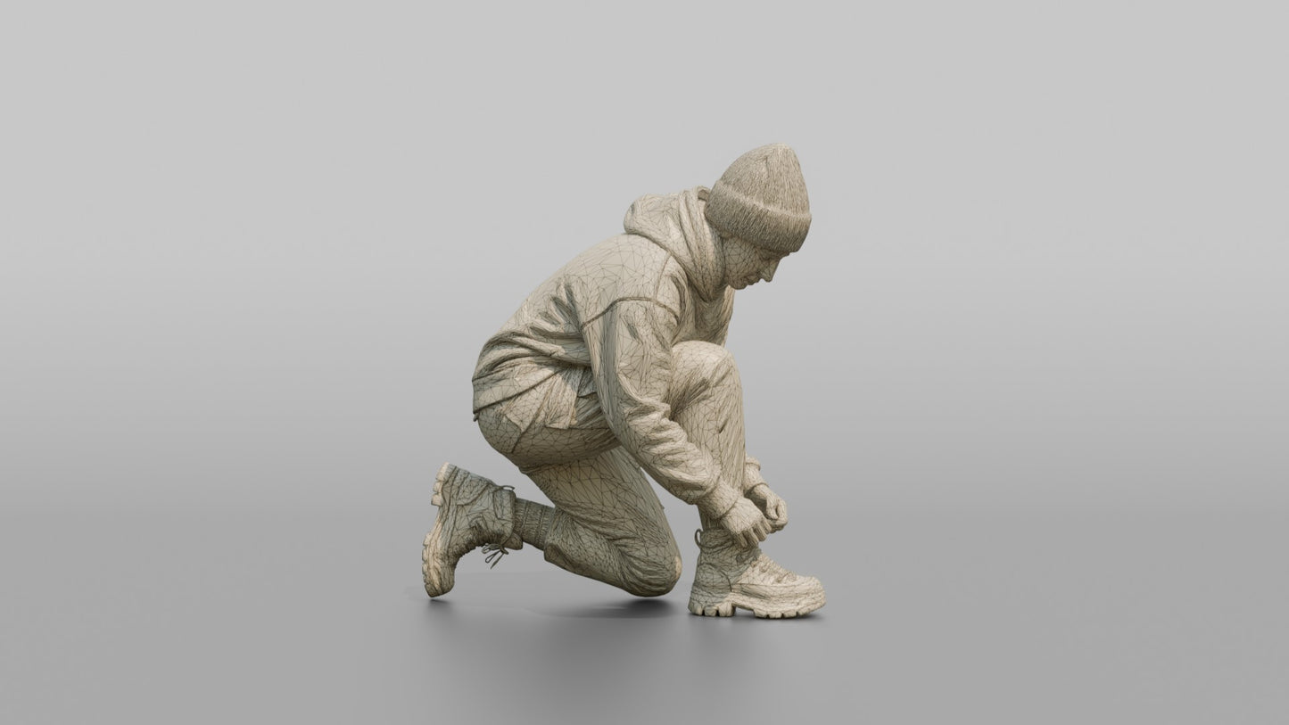 Woman Kneeling to Adjust Her Boots