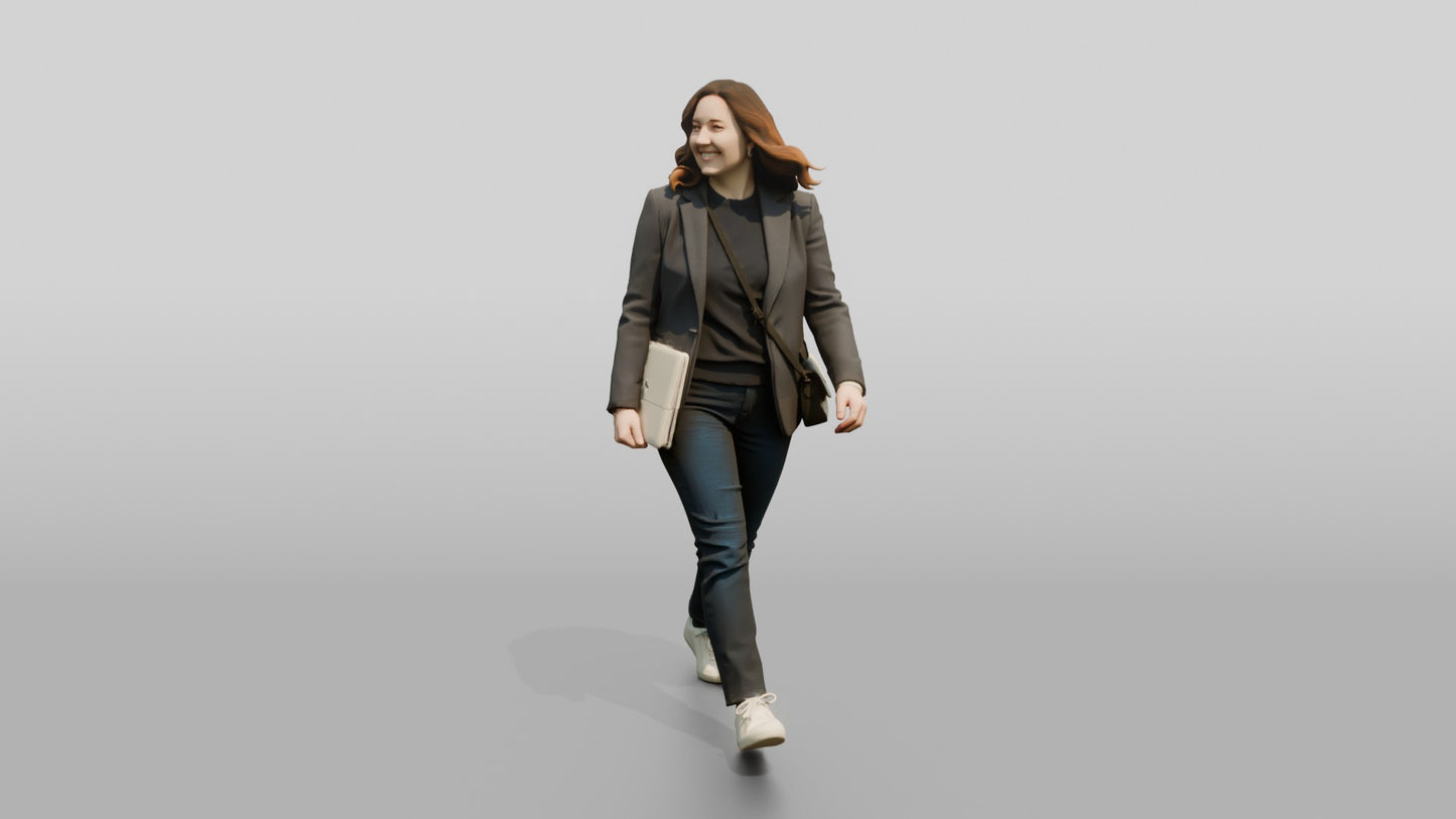 Businesswoman Walking with a Laptop
