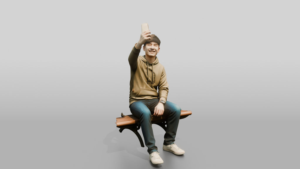 Young Chinese Man Taking a Selfie on a Bench