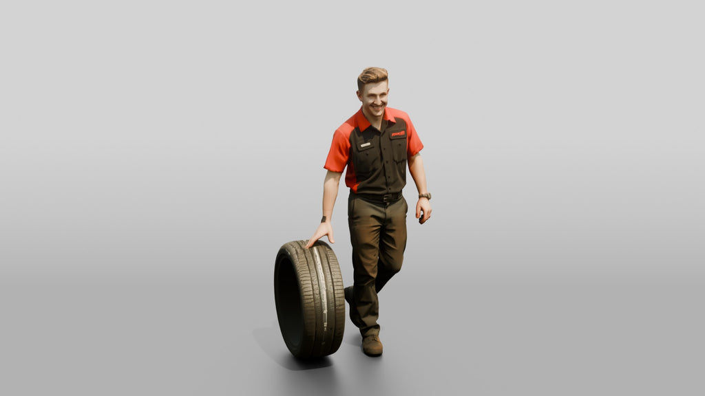 Mechanic Rolling a Performance Tire