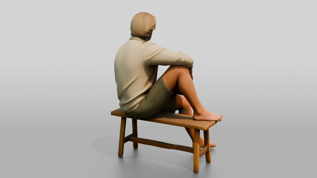 Man Reading a Book on a Bench