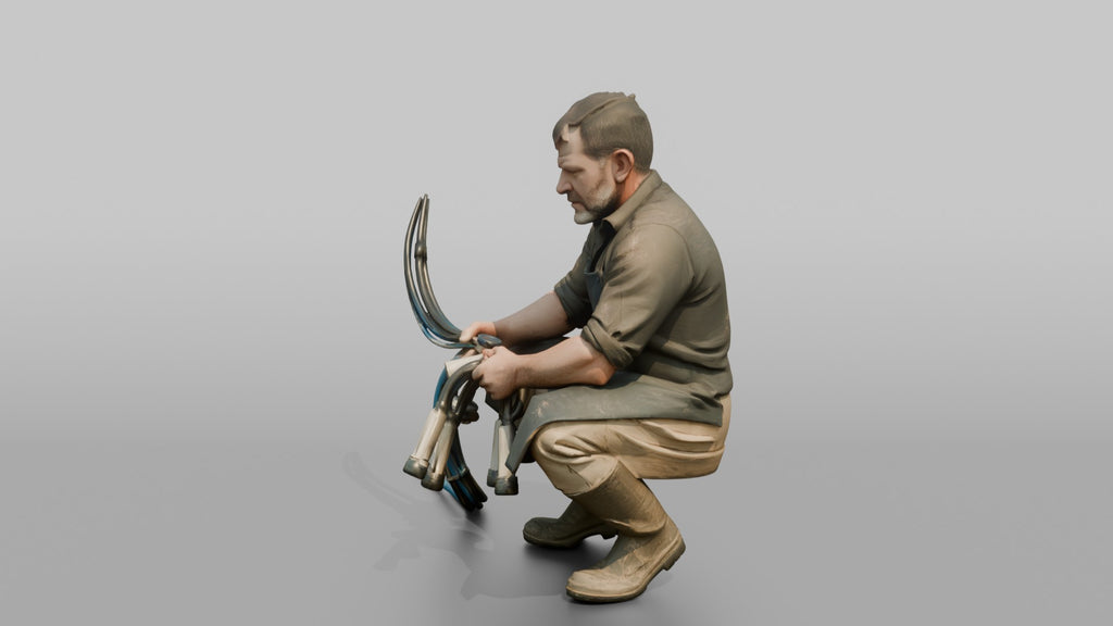 Farmer Crouching Down Holding Automated Milking Apparatus Equipment