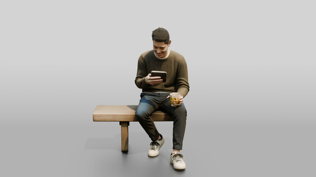 Young Chinese Man Relaxing on a Bench with Phone