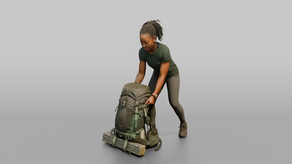 Backpacker Lowering Her Pack to the Ground