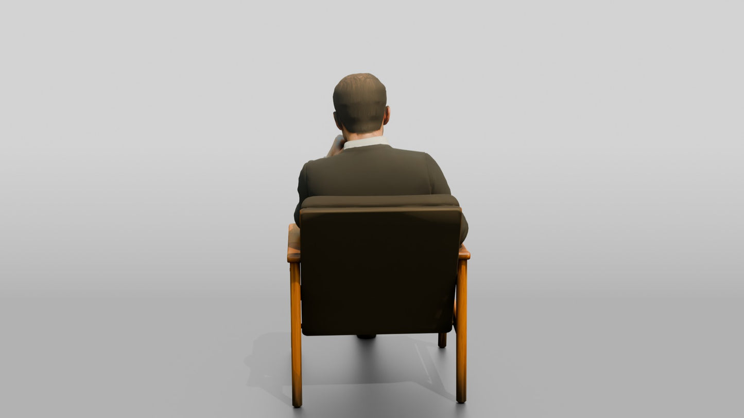 Man Sitting Thoughtfully in a Chair
