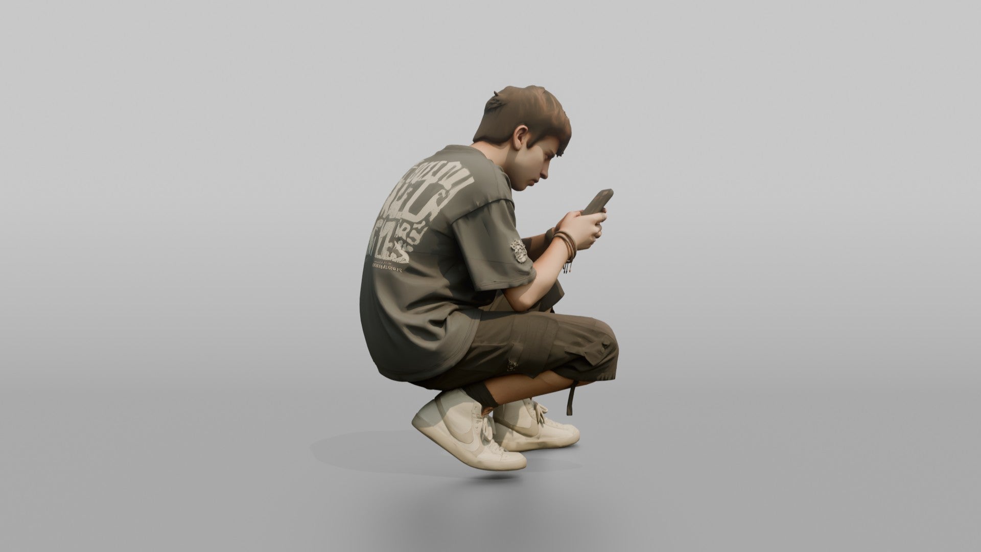 Teenage Boy Crouching to Look at His Phone