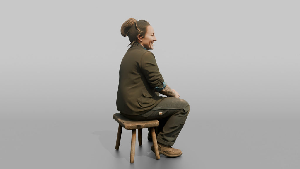 Farmer Sitting On Stool In Milking Position