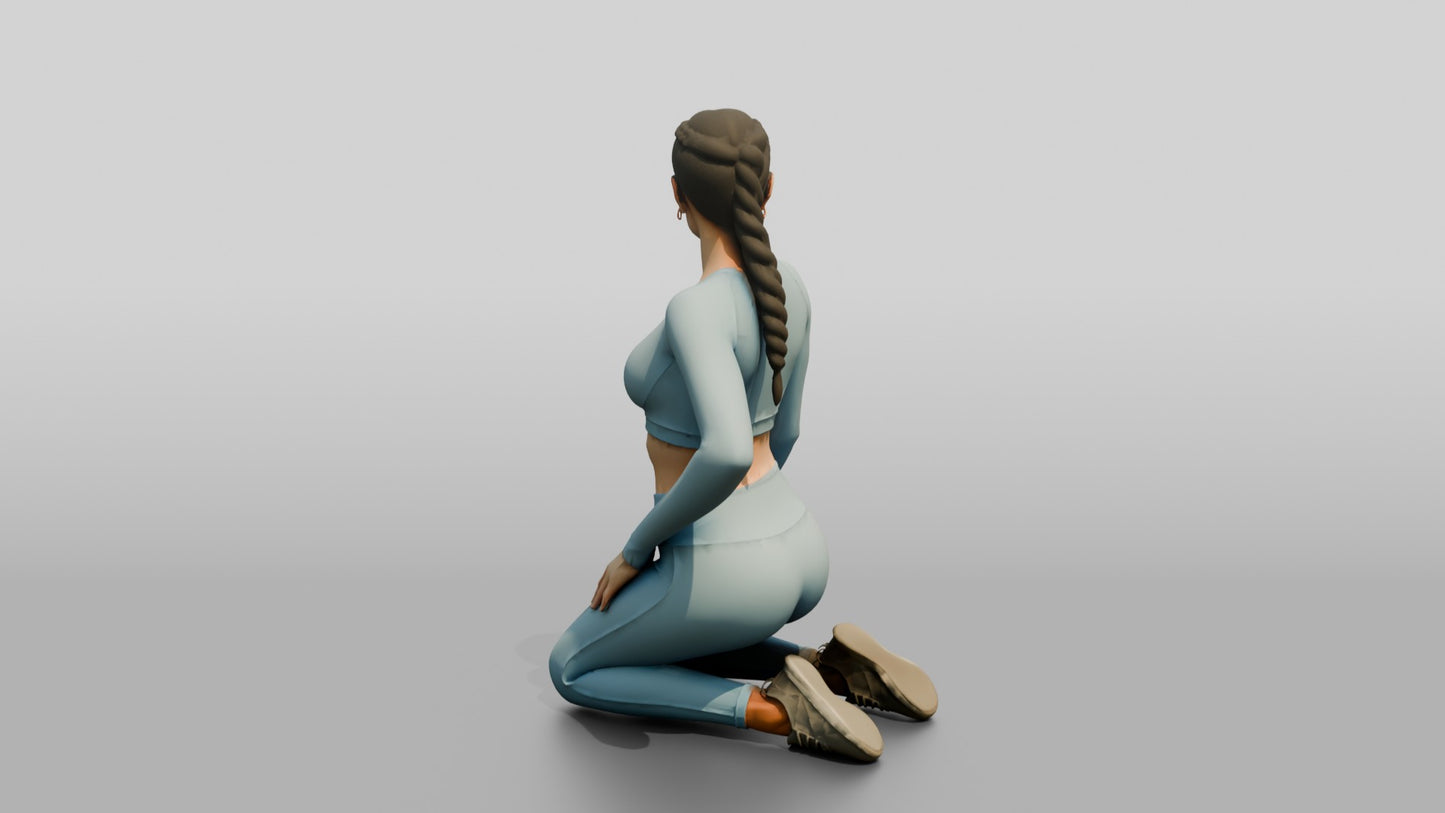 Woman Kneeling in Dusty Blue Long-Sleeve Activewear