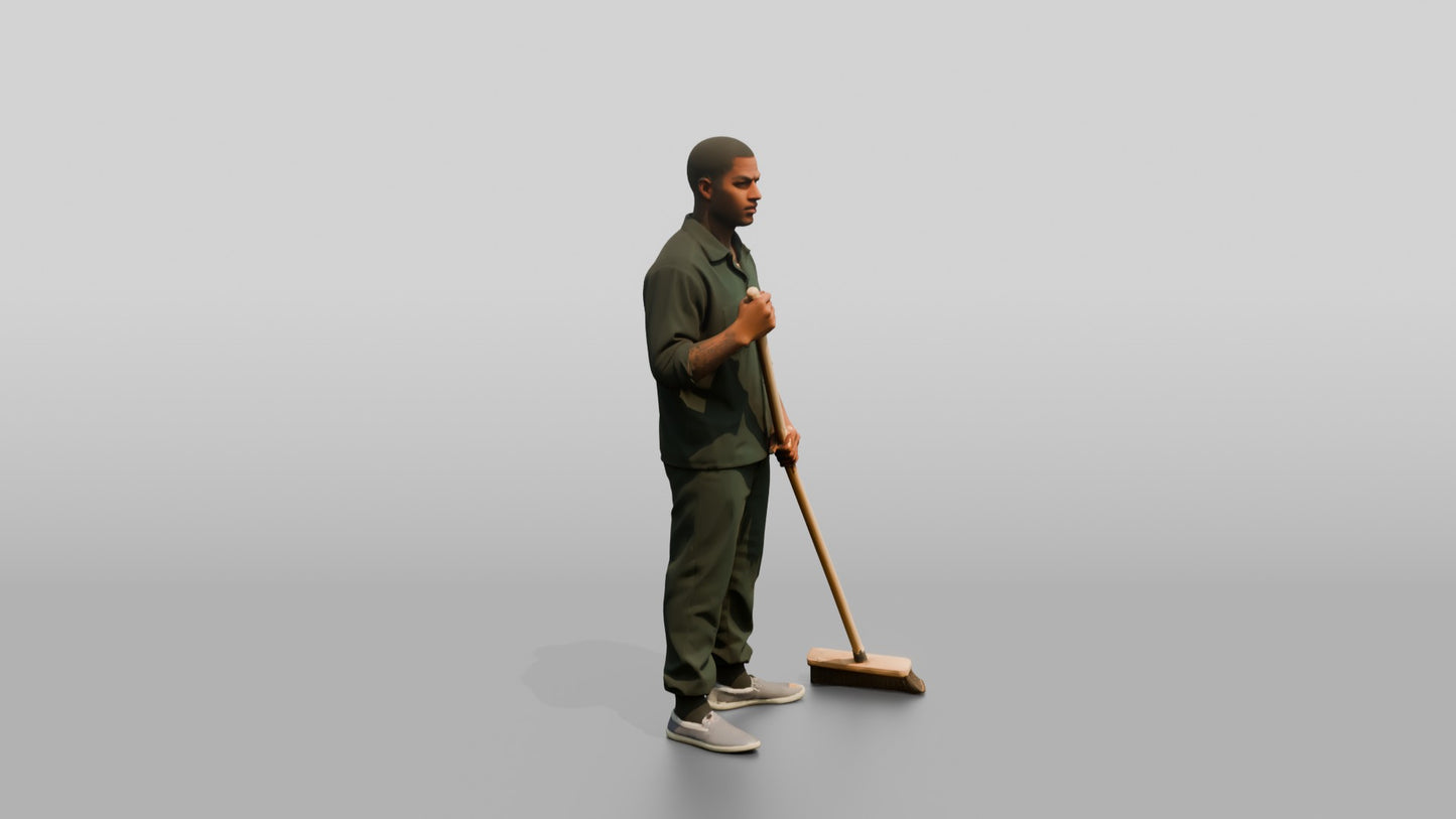 Black Male Prisoner in a Dark Green Uniform Holding a Push-broom