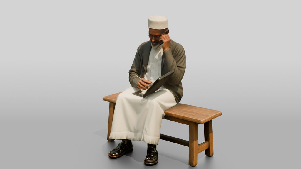 Elderly African Man Reading a Tablet on a Bench