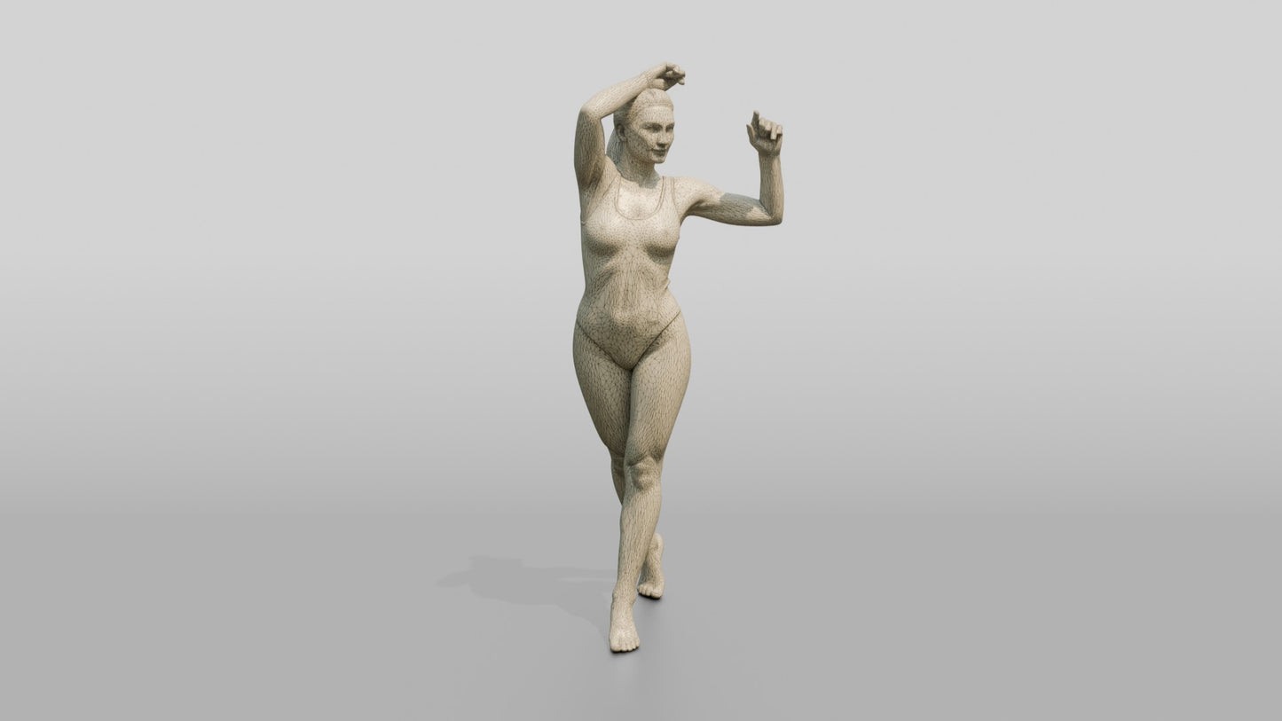 Woman in Teal Swimsuit in a Dancing Pose
