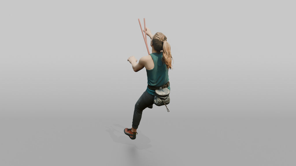 Rock Climber Reaching Upward Mid-Climb