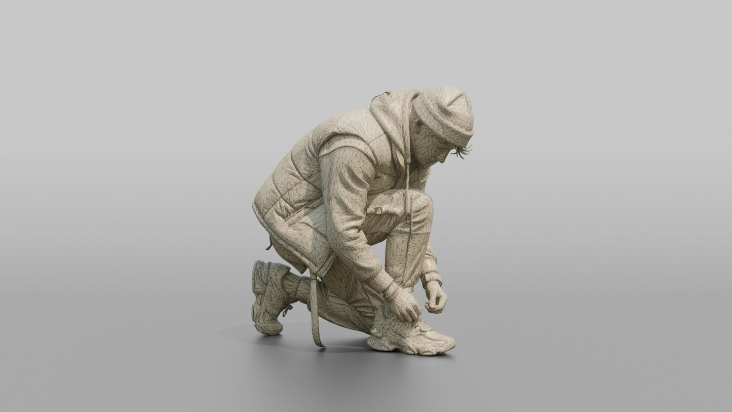 Man Crouching to Tie His Sneaker Laces
