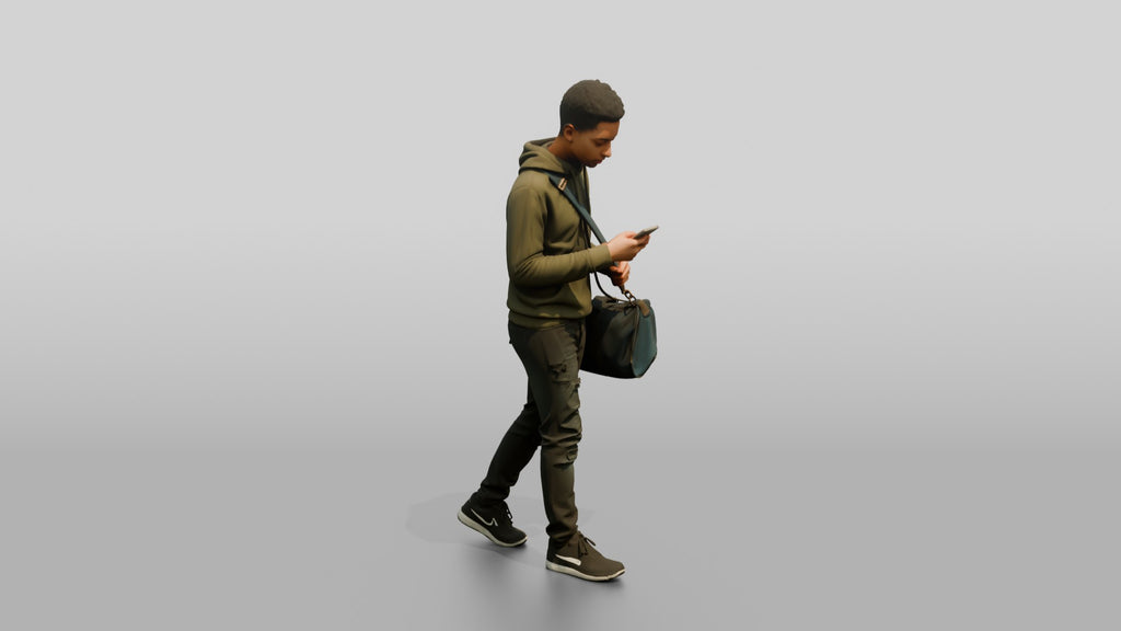 Young Black Man Walking and Looking at Phone with Duffel Bag