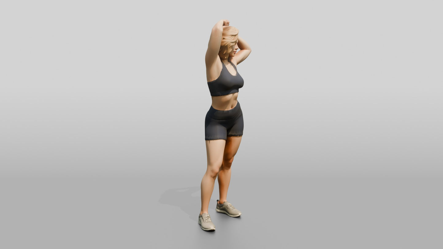 Blonde Woman in Charcoal Activewear Adjusting Her Hair