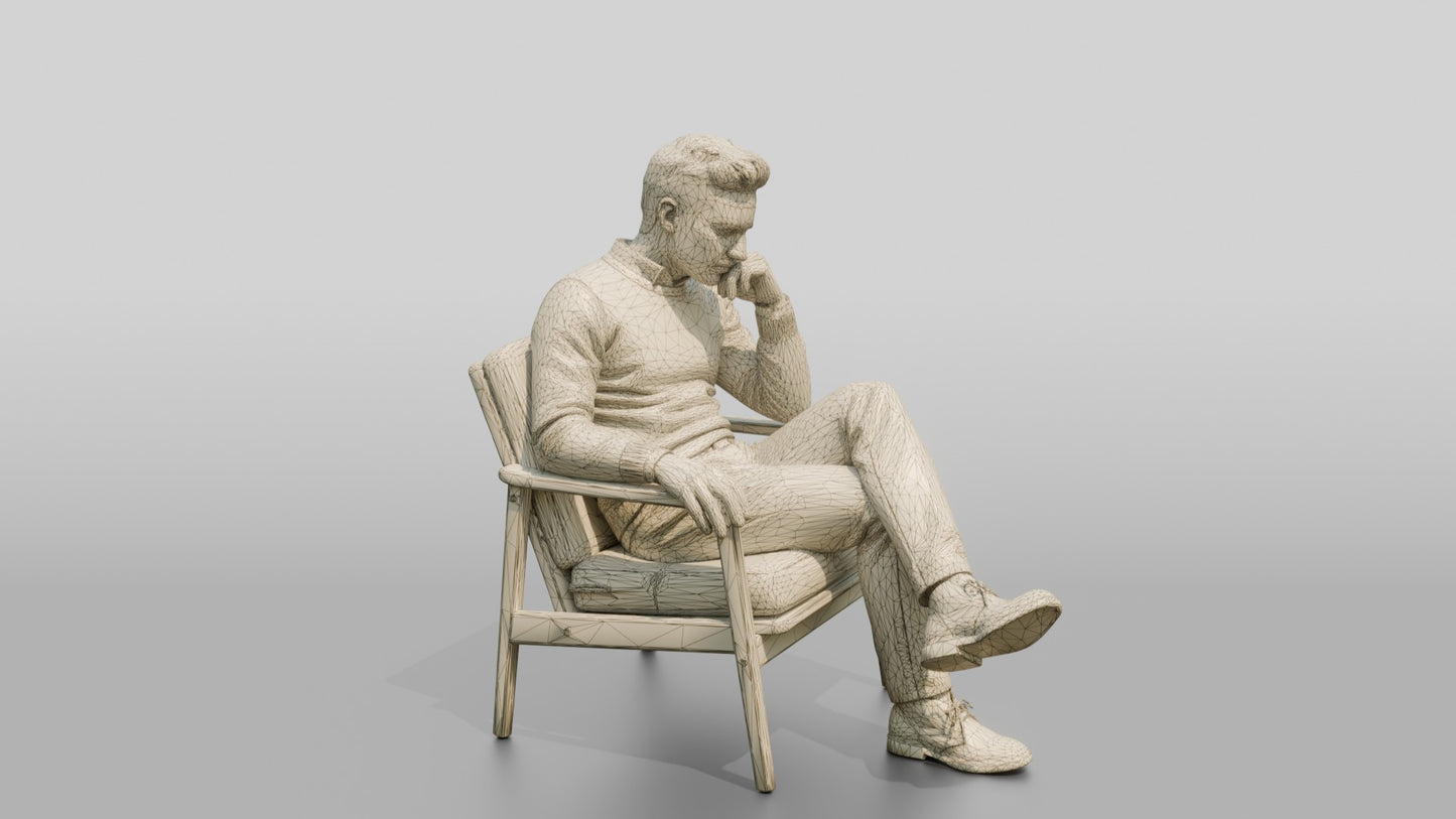 Man Sitting Thoughtfully in a Chair
