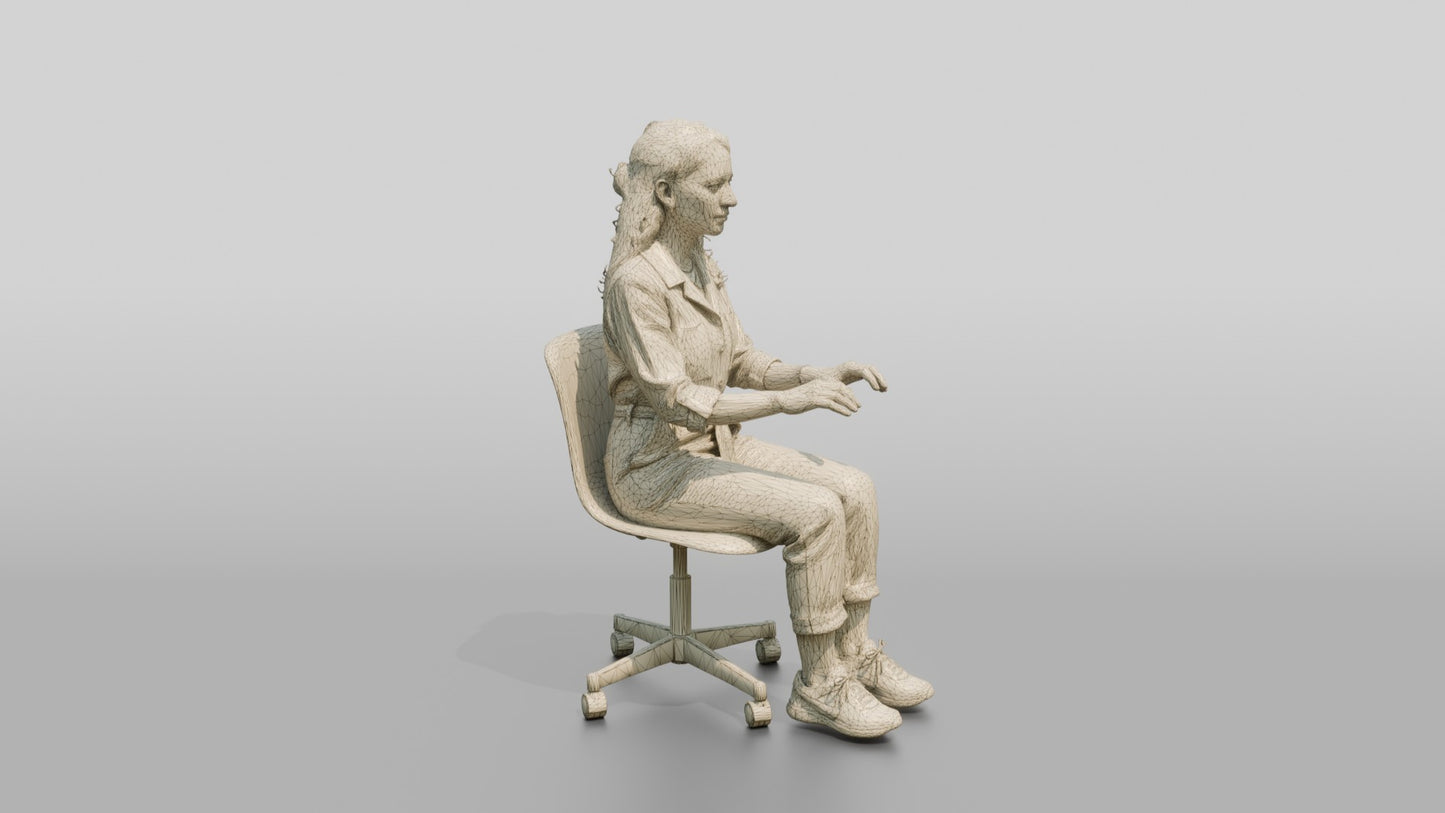 Woman Seated in a Teal Jumpsuit