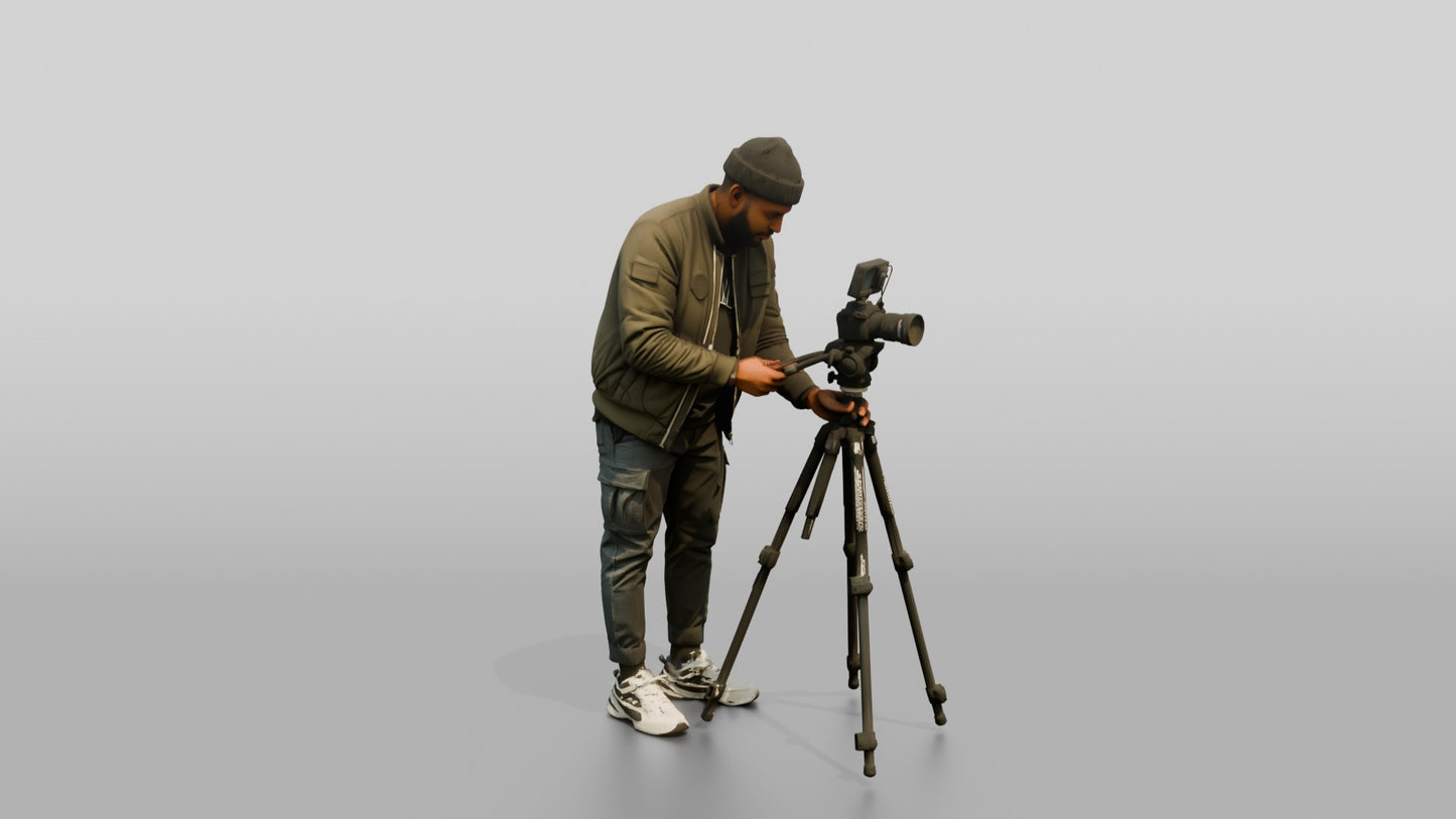 Videographer Setting Up a Camera