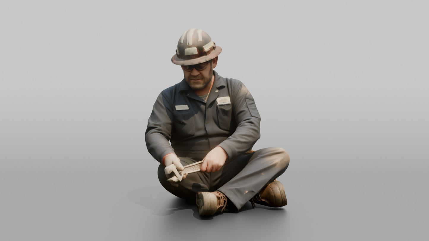 Engineer Tightening a Bolt on a Pipe Fitting