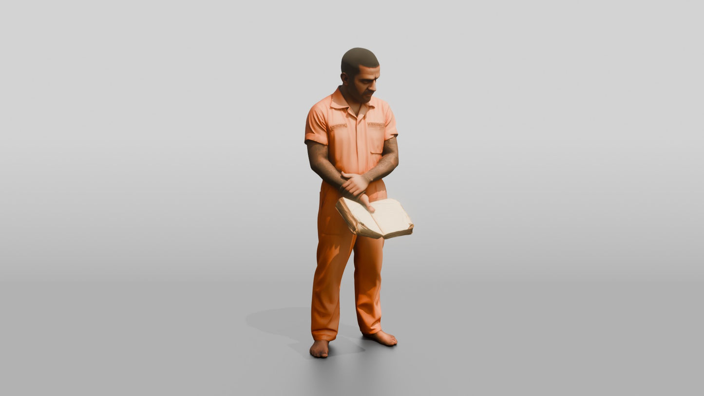 South Asian Male Prisoner Holding a Worn Book Open in One Hand