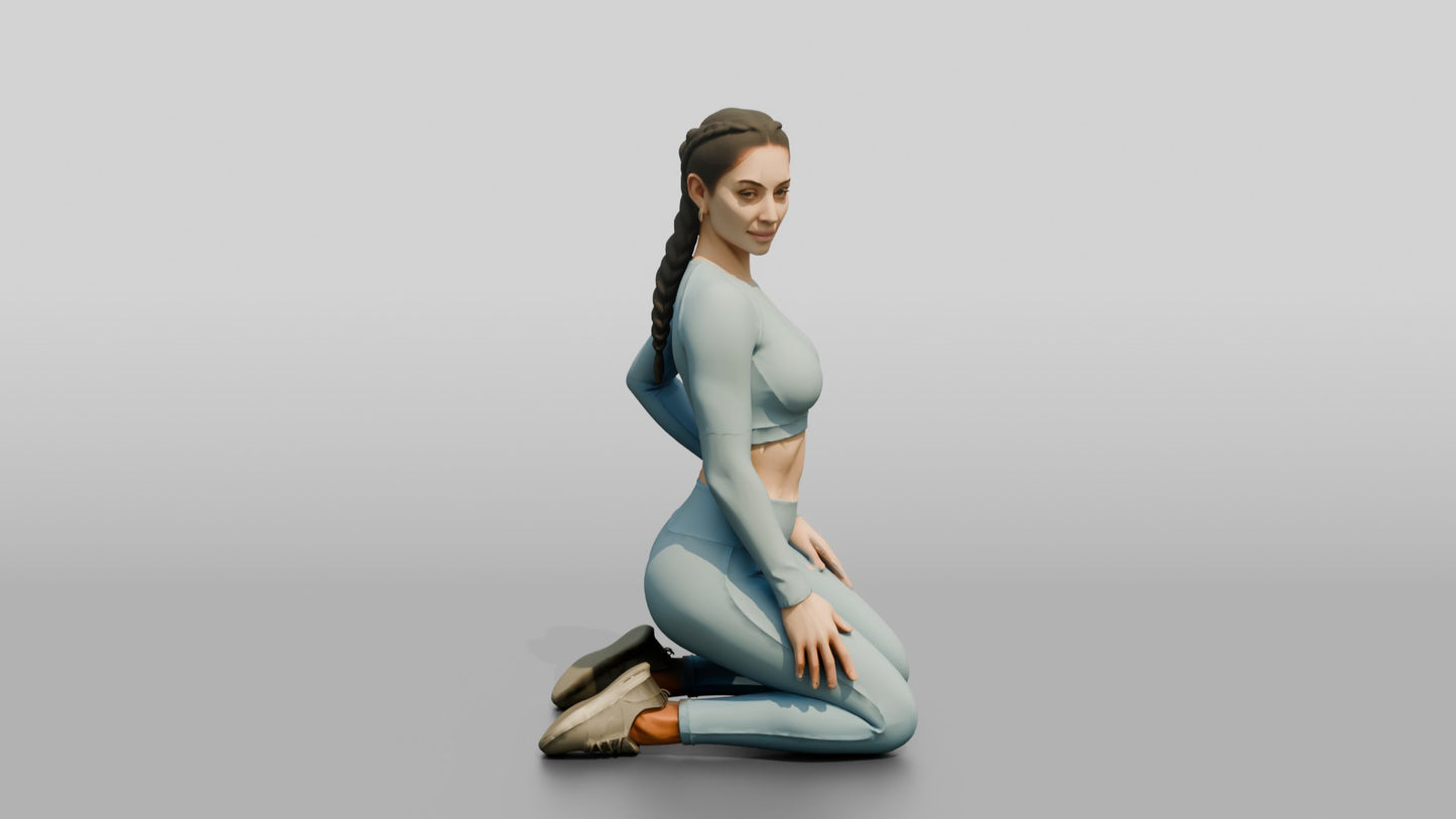 Woman Kneeling in Dusty Blue Long-Sleeve Activewear