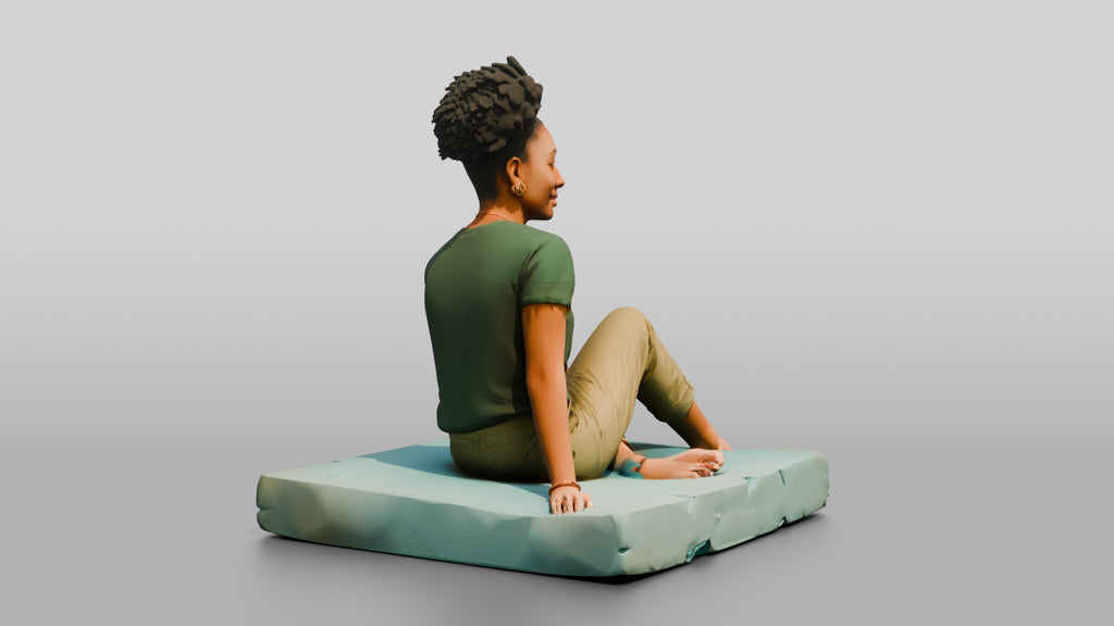 Homeless Woman Sitting on a Piece of Foam Padding