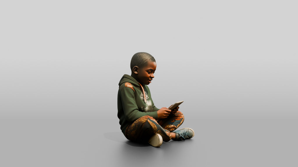 African Boy Sitting Cross-Legged with a Tablet