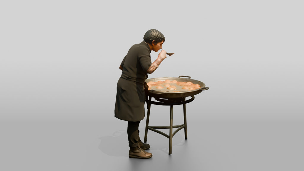 Chef Checking a Paella Pan