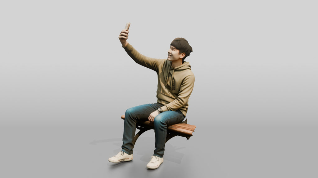 Young Chinese Man Taking a Selfie on a Bench