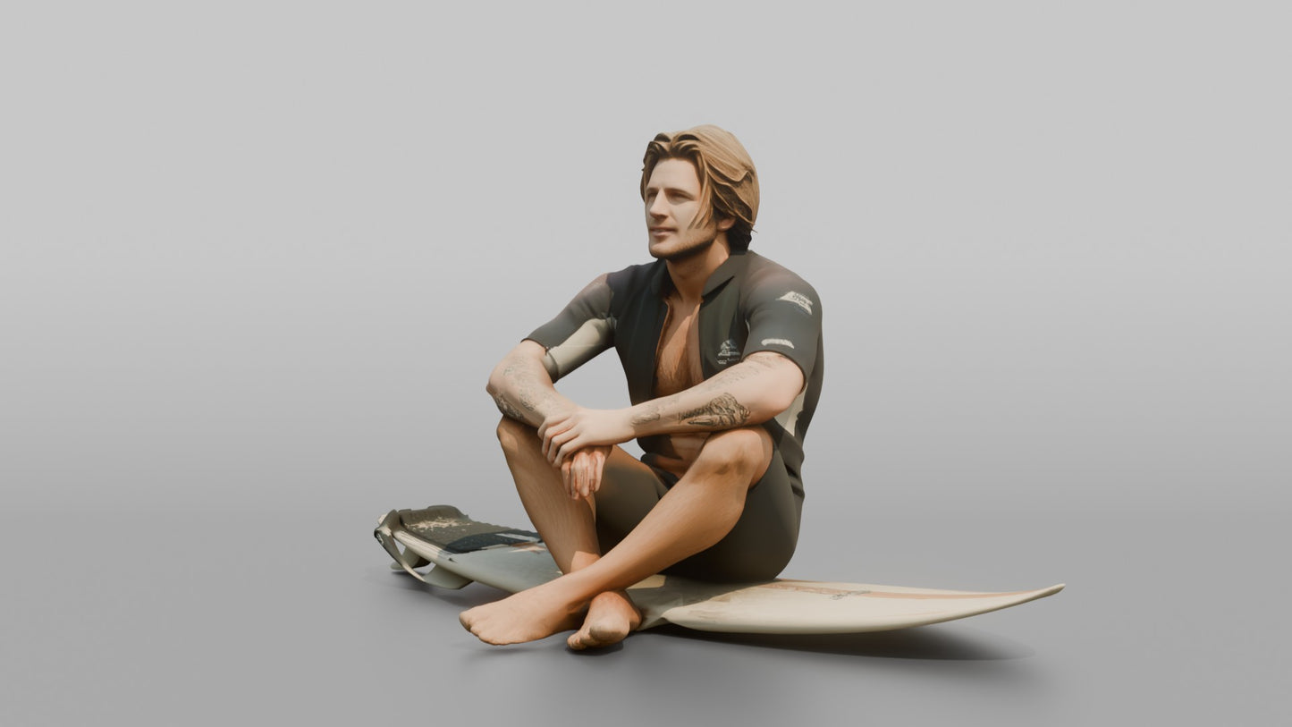 Surfer Sitting on His Surfboard