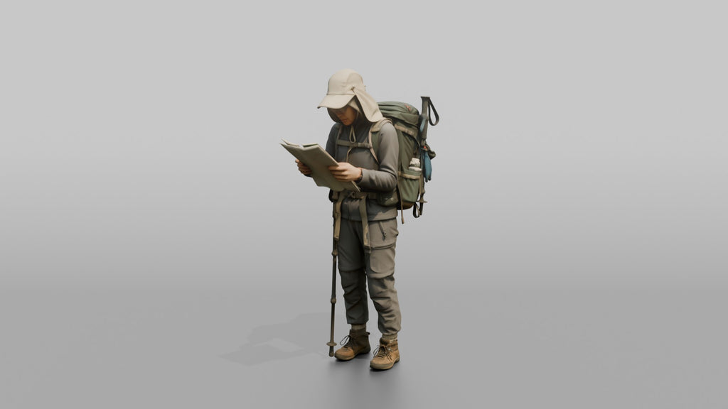 Trekker Inspecting a Trail Map