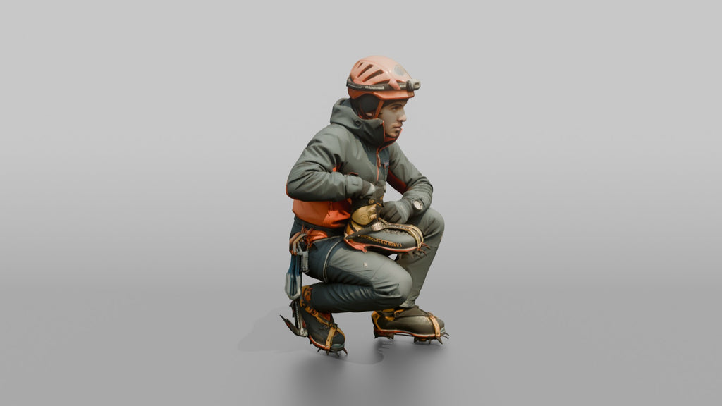 Ice Climber Crouched in an Active Posture
