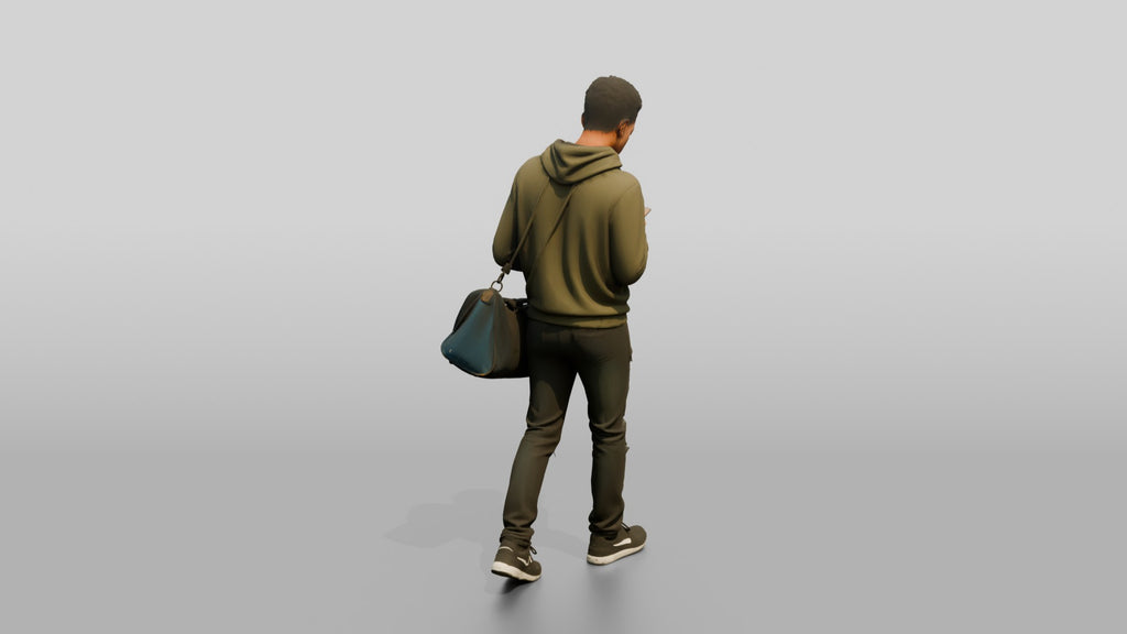 Young Black Man Walking and Looking at Phone with Duffel Bag