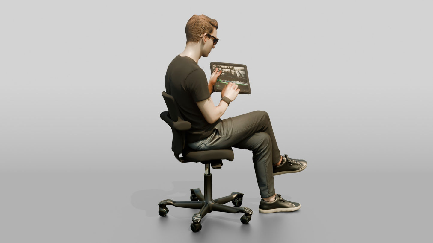 Man Seated with a Tablet and Glasses
