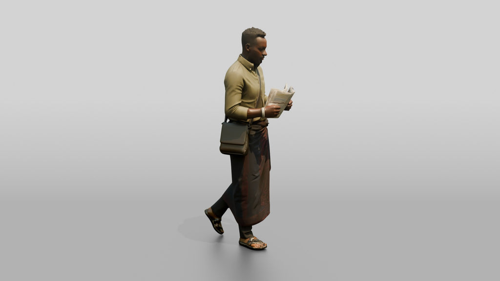 African Man Reading a Map in a Wrap Skirt