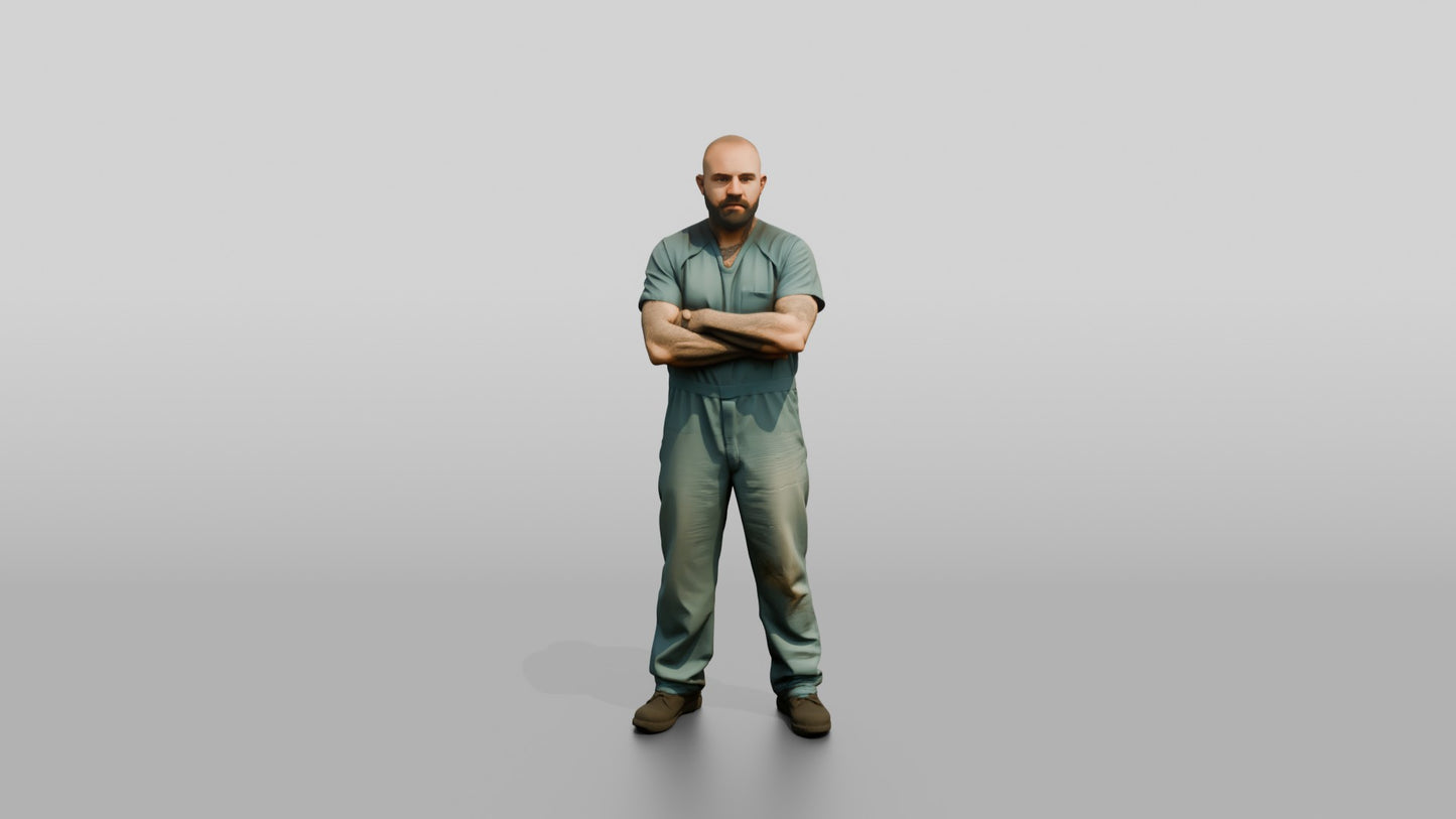 White Male Prisoner Standing with His Arms Crossed Defensively