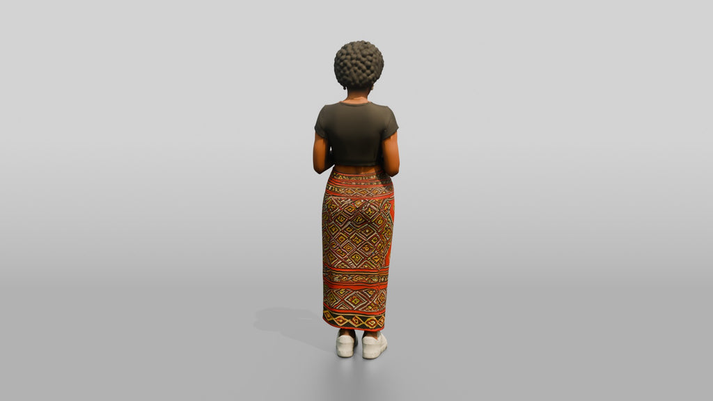 African Woman in a Wrap Skirt Looking at Her Phone