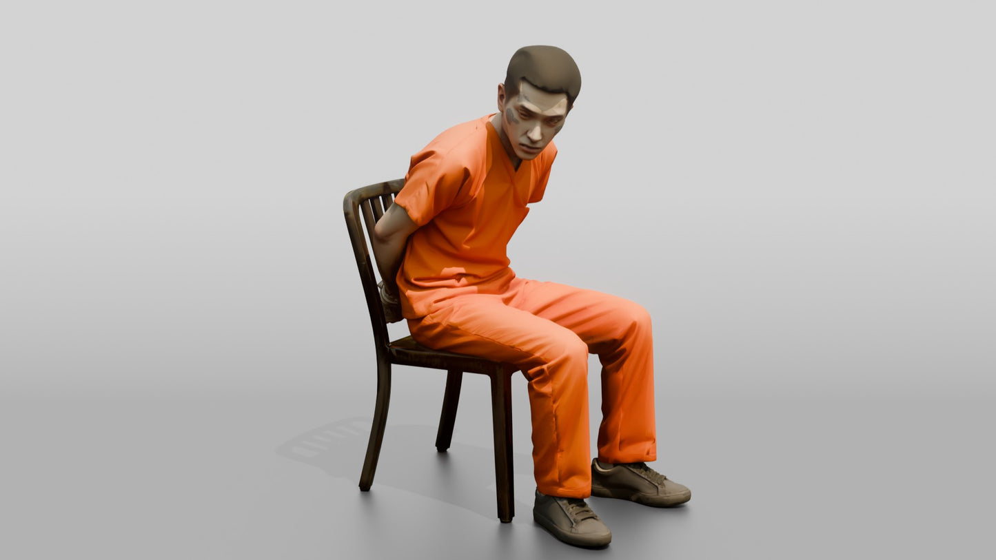 East Asian Male Prisoner Sitting Slouched in a Metal Chair