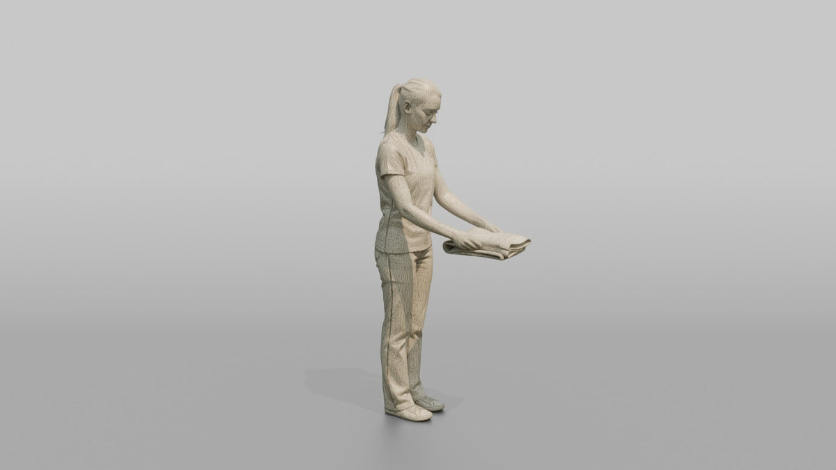 Woman Shop Assistant Folding A Pair Of Jeans - wireframe topology preview
