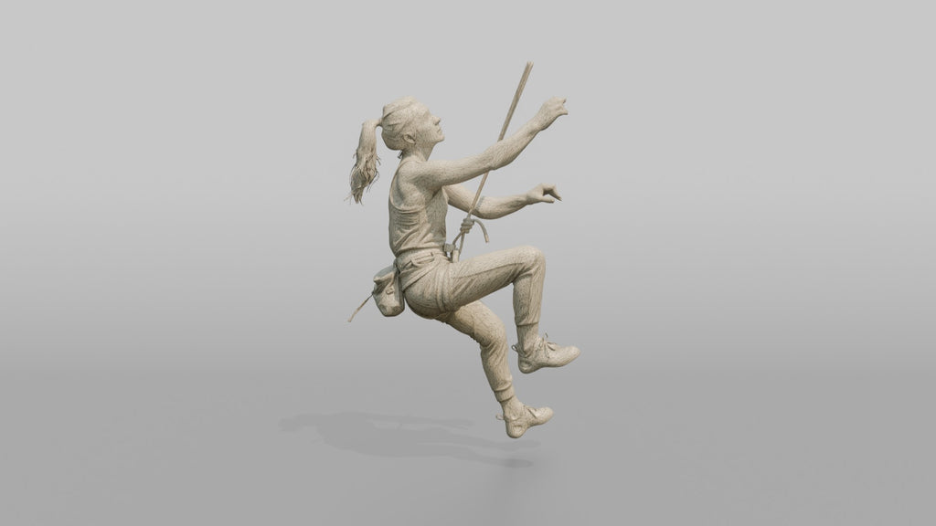 Rock Climber Reaching Upward Mid-Climb