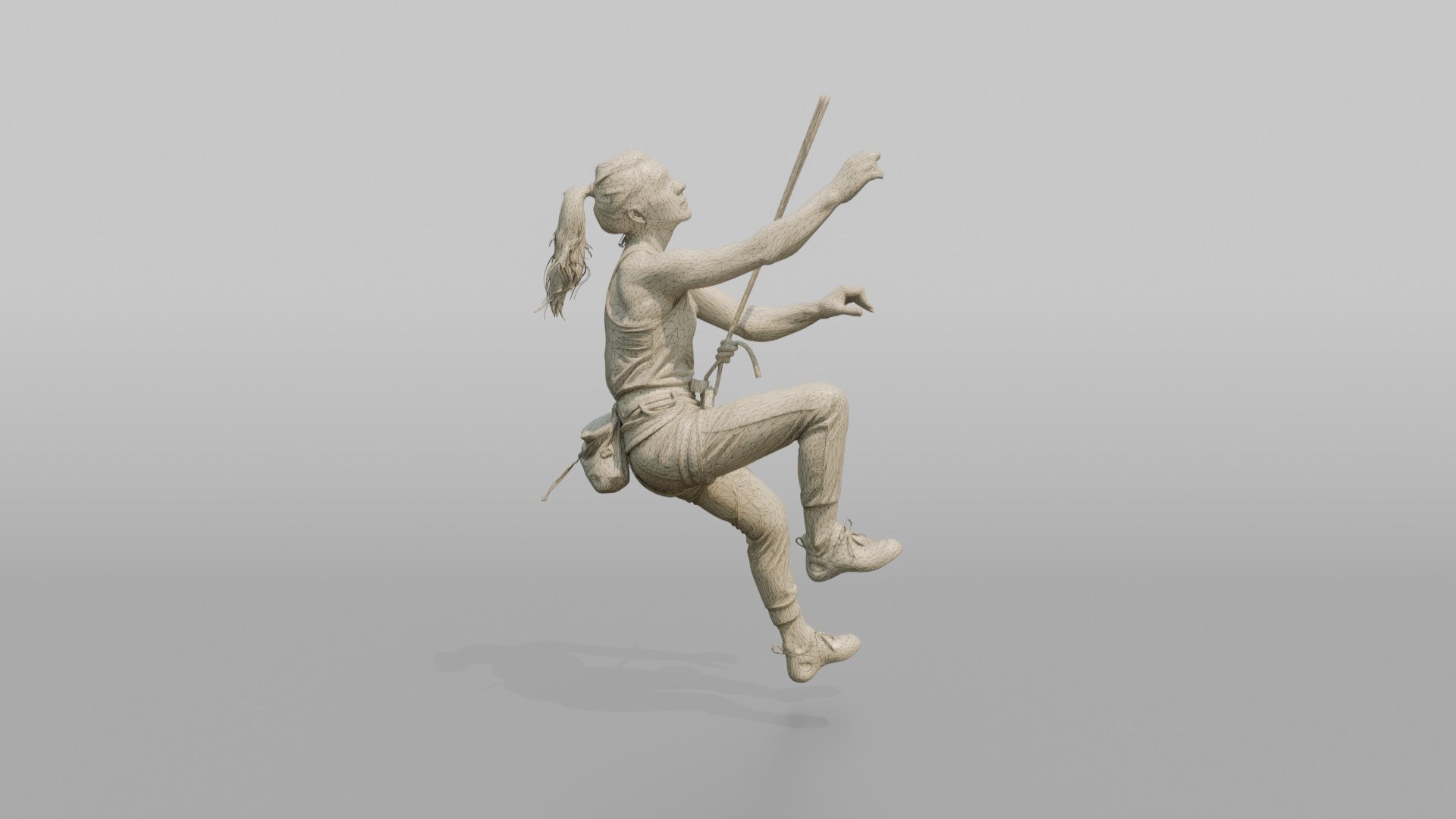 Rock Climber Reaching Upward Mid-Climb